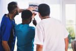 three person looking at x ray result 1170979